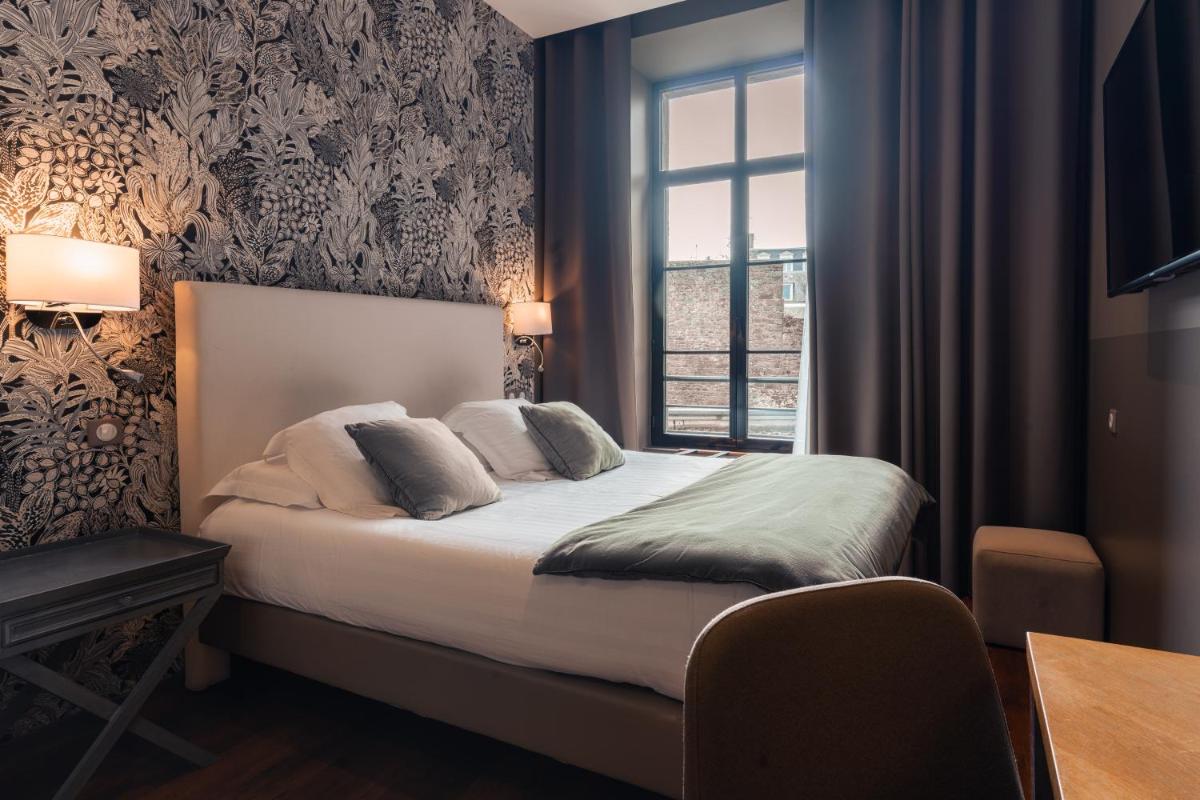 Un ou plusieurs lits dans un hébergement de l'établissement Edgar Hôtel & Spa - Table Gastronomique
