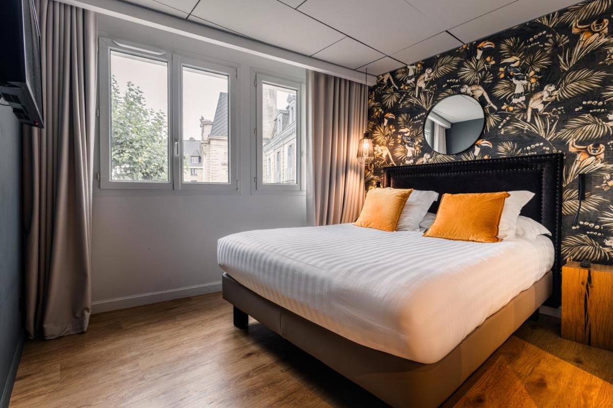 Un ou plusieurs lits dans un hébergement de l'établissement Edgar Hôtel & Spa - Table Gastronomique