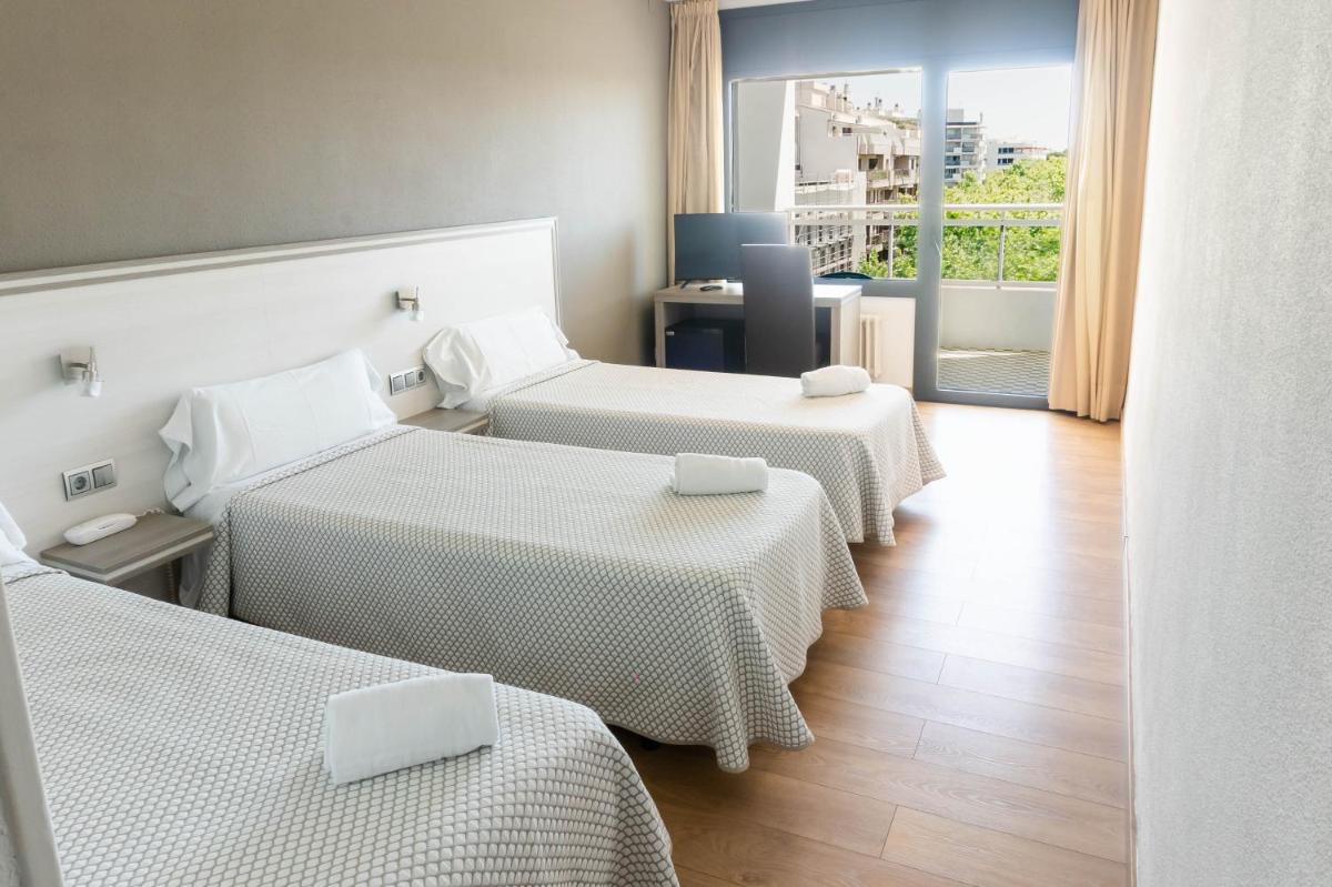 Cama o camas de una habitación en Hotel Planas