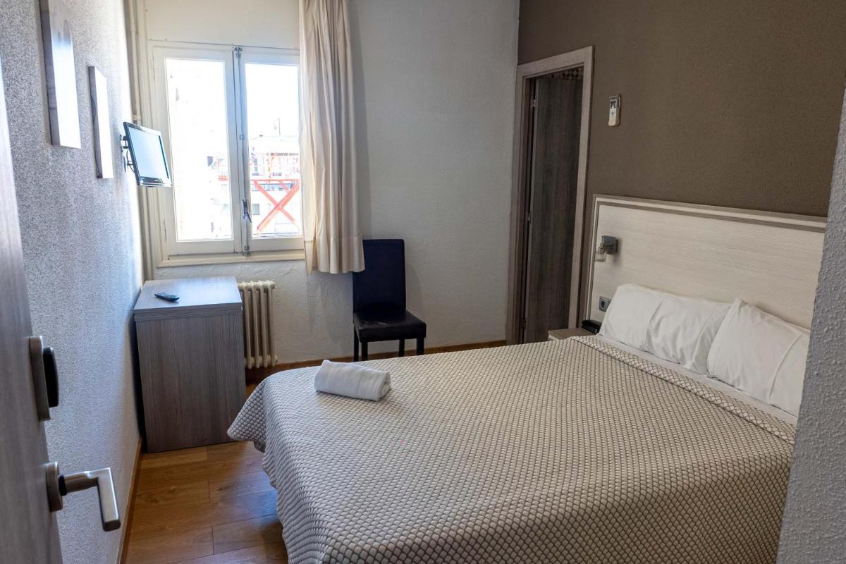 Cama o camas de una habitación en Hotel Planas