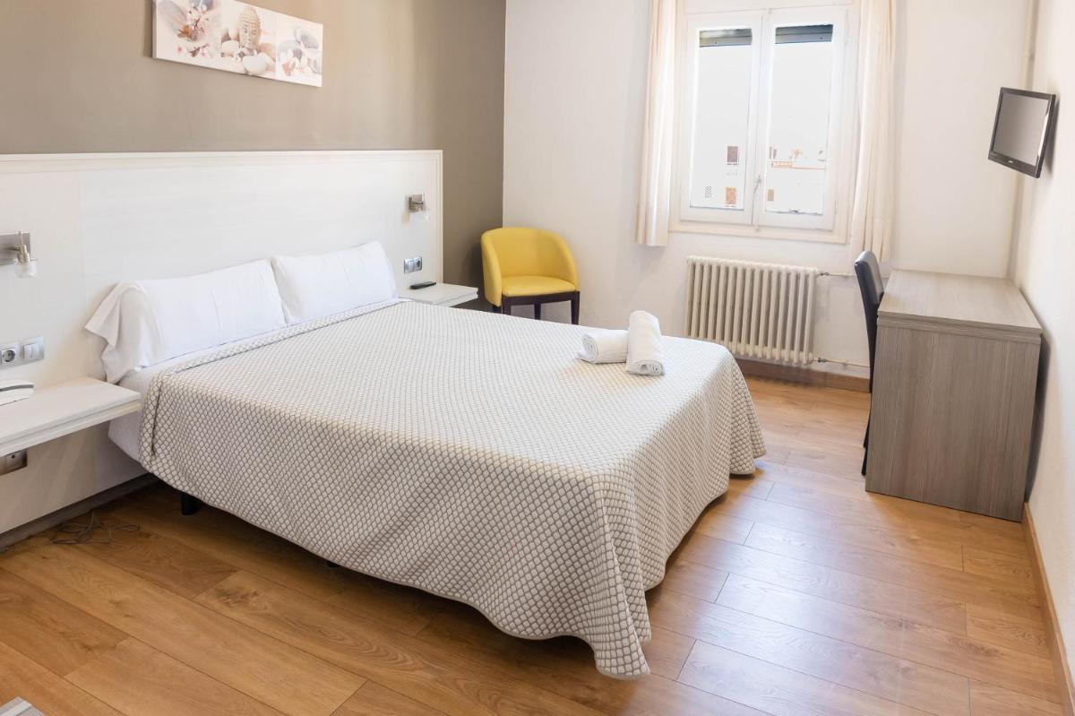 Cama o camas de una habitación en Hotel Planas