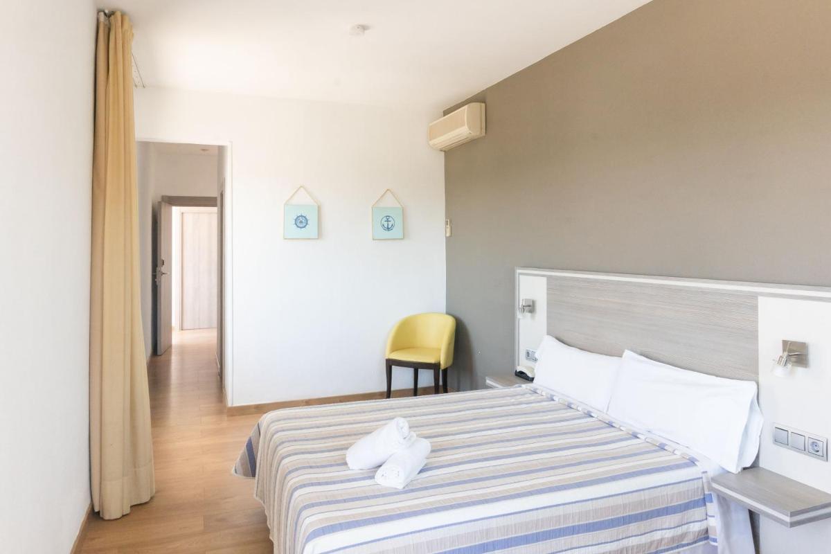 Cama o camas de una habitación en Hotel Planas