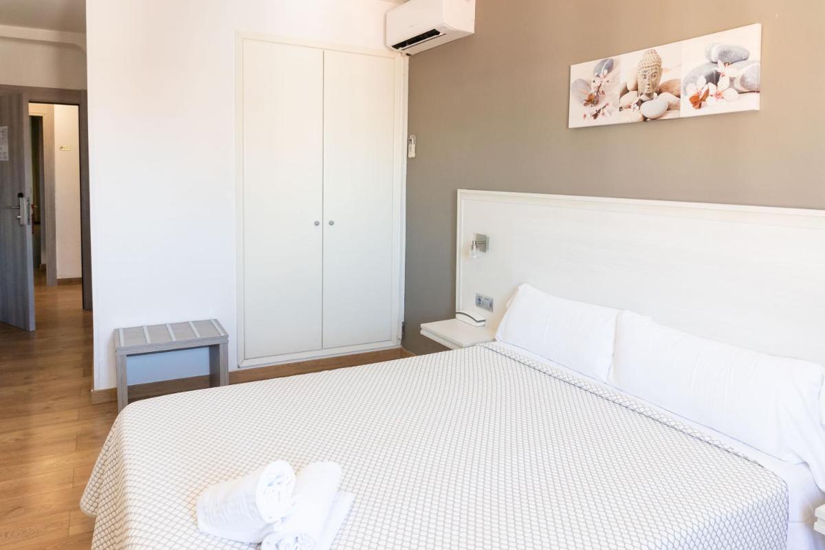 Cama o camas de una habitación en Hotel Planas