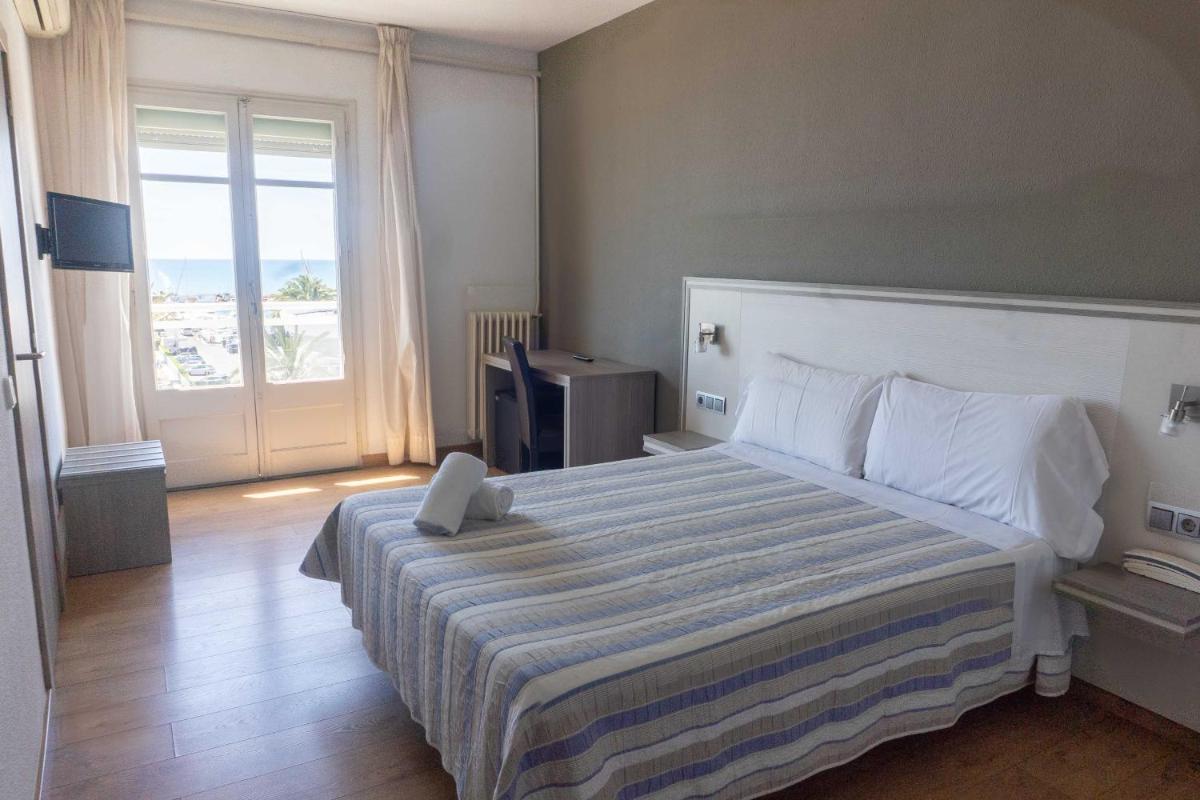 Cama o camas de una habitación en Hotel Planas