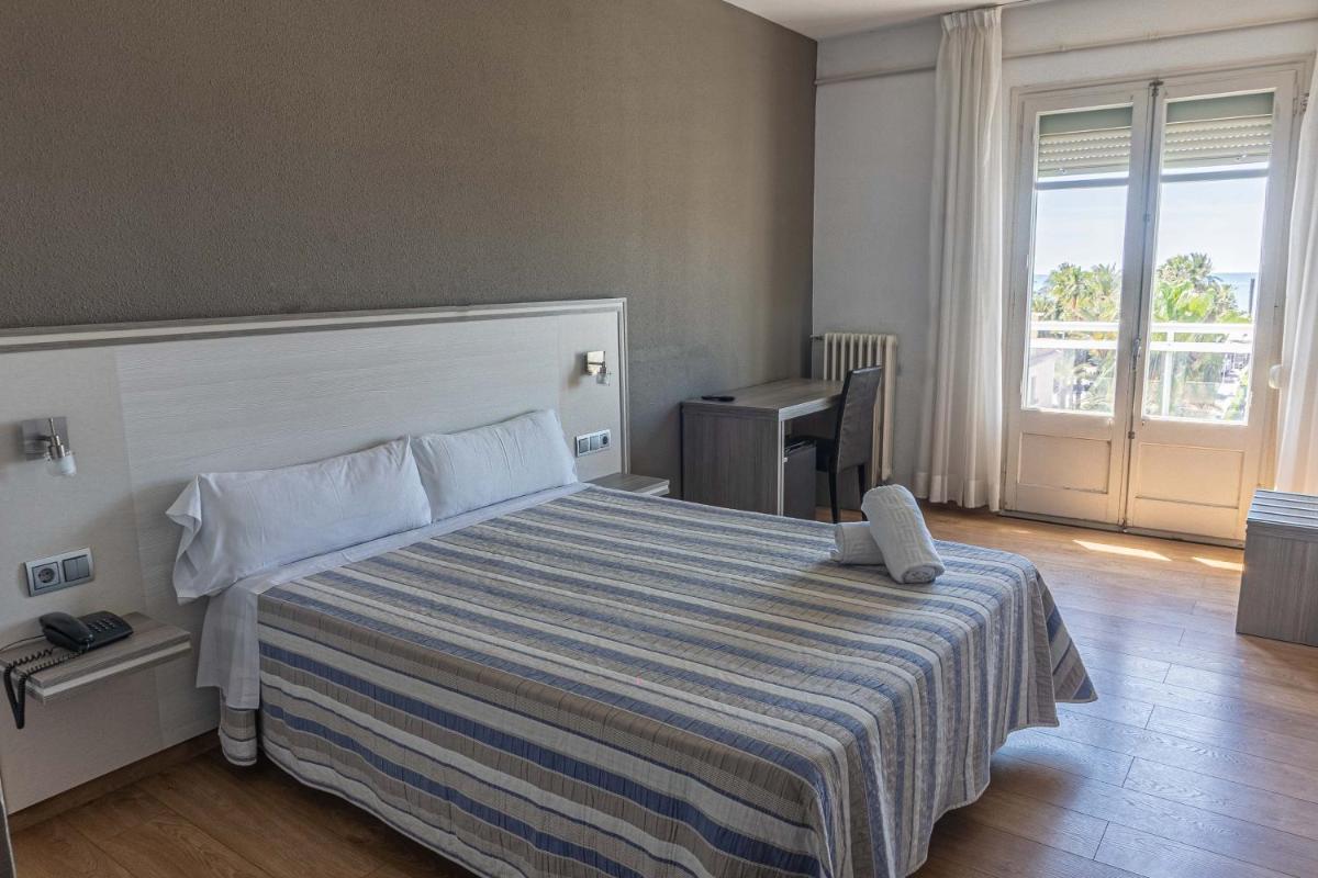 Cama o camas de una habitación en Hotel Planas