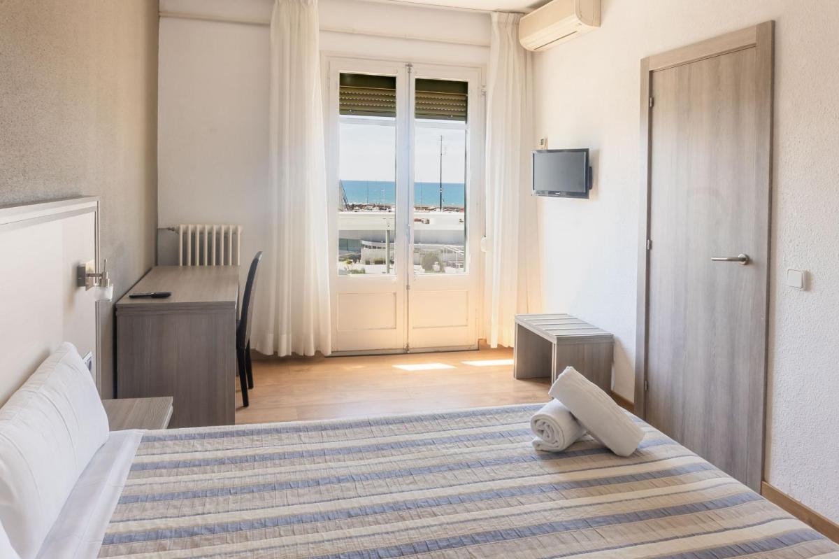 Cama o camas de una habitación en Hotel Planas