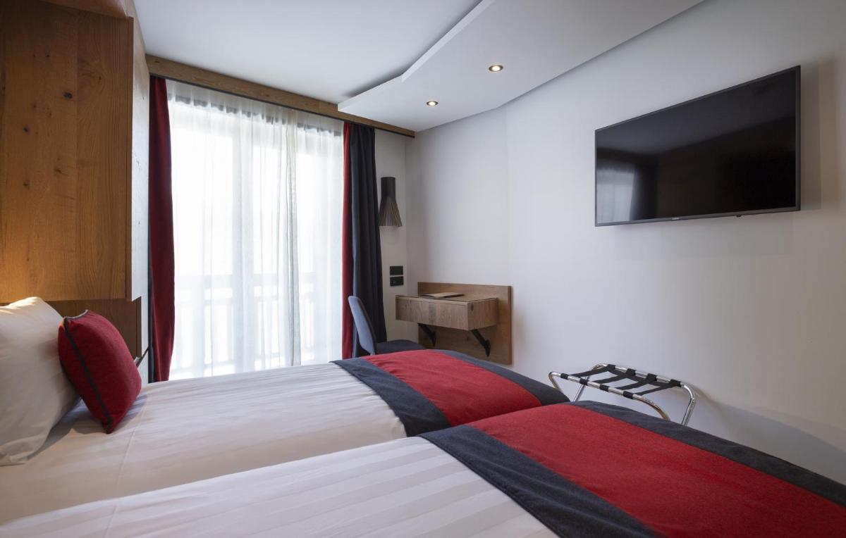 Télévision ou salle de divertissement dans l'établissement Hôtel Alparena & Spa - 4 étoiles