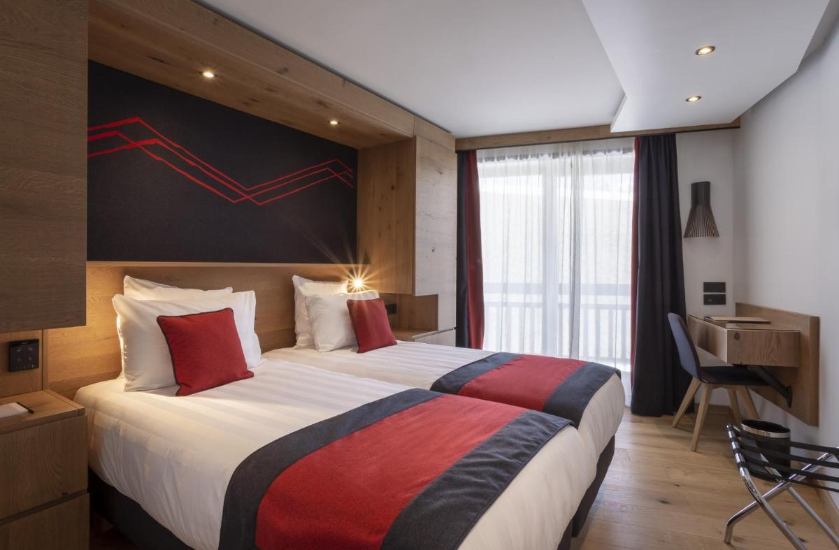 Un ou plusieurs lits dans un hébergement de l'établissement Hôtel Alparena & Spa - 4 étoiles