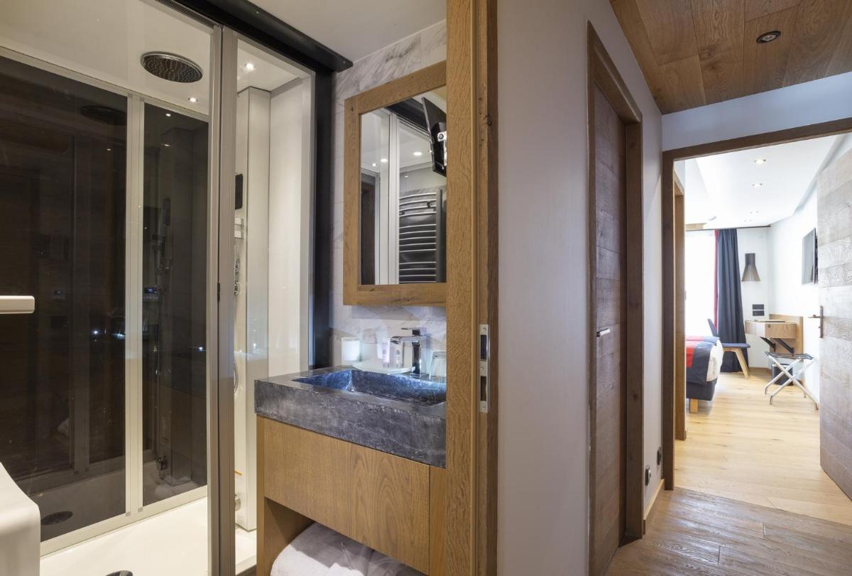 Un ou plusieurs lits dans un hébergement de l'établissement Hôtel Alparena & Spa - 4 étoiles