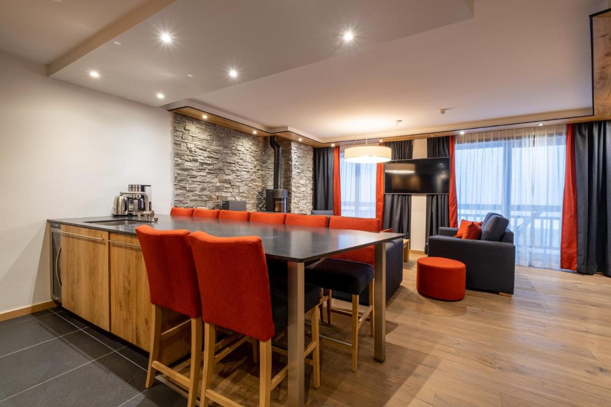 Cuisine ou kitchenette dans l'établissement Hôtel Alparena & Spa - 4 étoiles