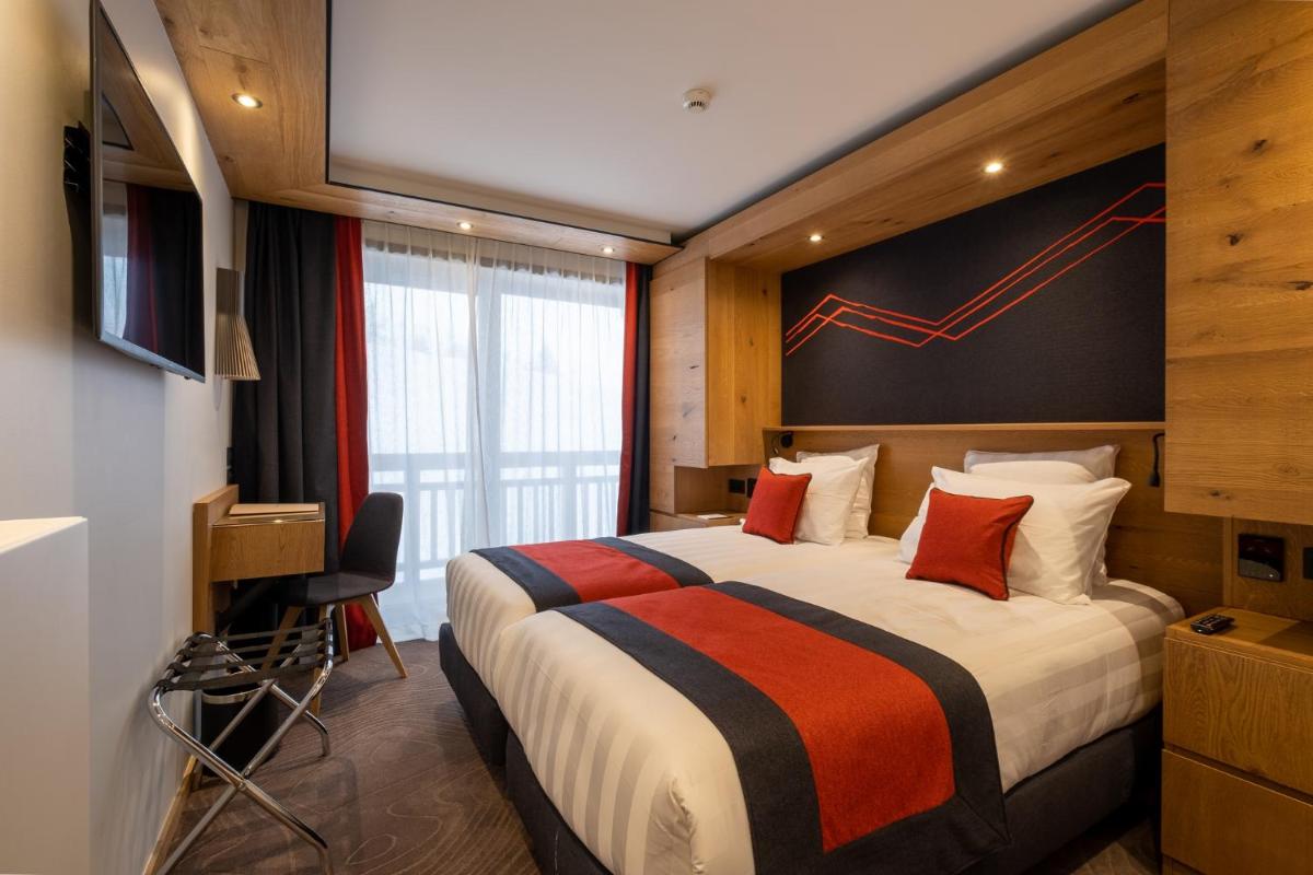 Un ou plusieurs lits dans un hébergement de l'établissement Hôtel Alparena & Spa - 4 étoiles