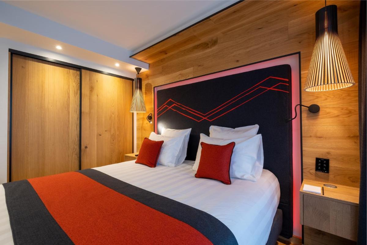 Un ou plusieurs lits dans un hébergement de l'établissement Hôtel Alparena & Spa - 4 étoiles