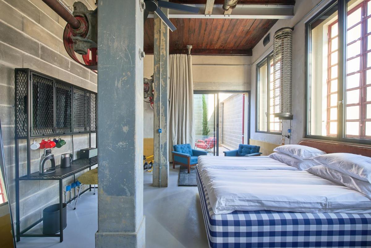 Uma cama ou camas num quarto em Moagem Industrial Lodge