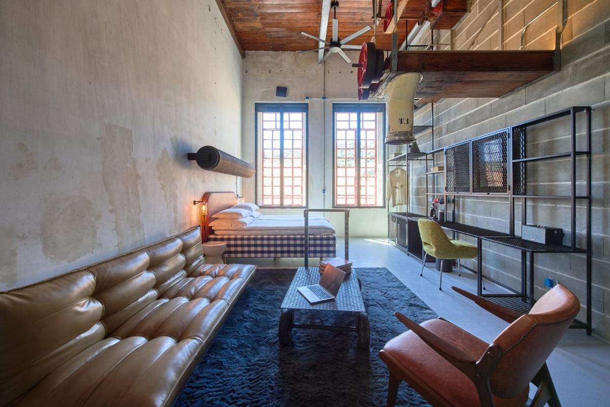 Uma área de estar em Moagem Industrial Lodge
