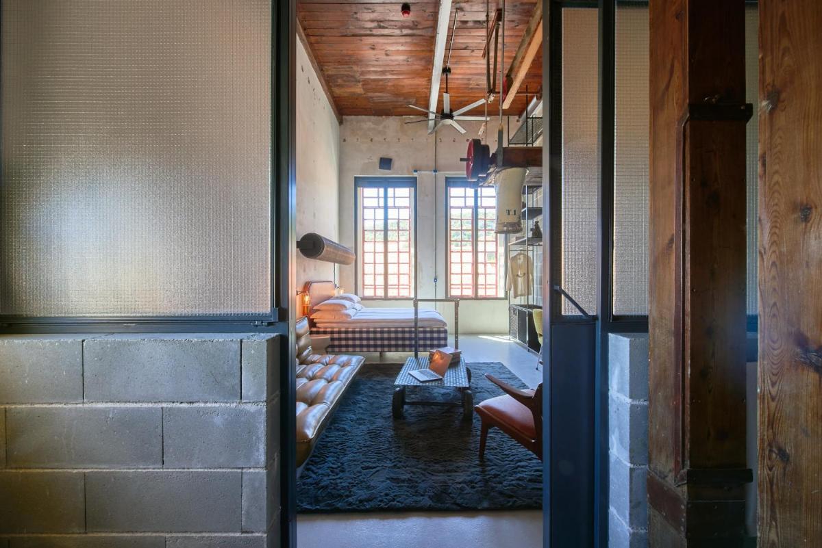 Uma cama ou camas num quarto em Moagem Industrial Lodge
