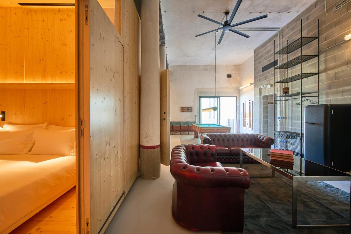 Uma área de estar em Moagem Industrial Lodge