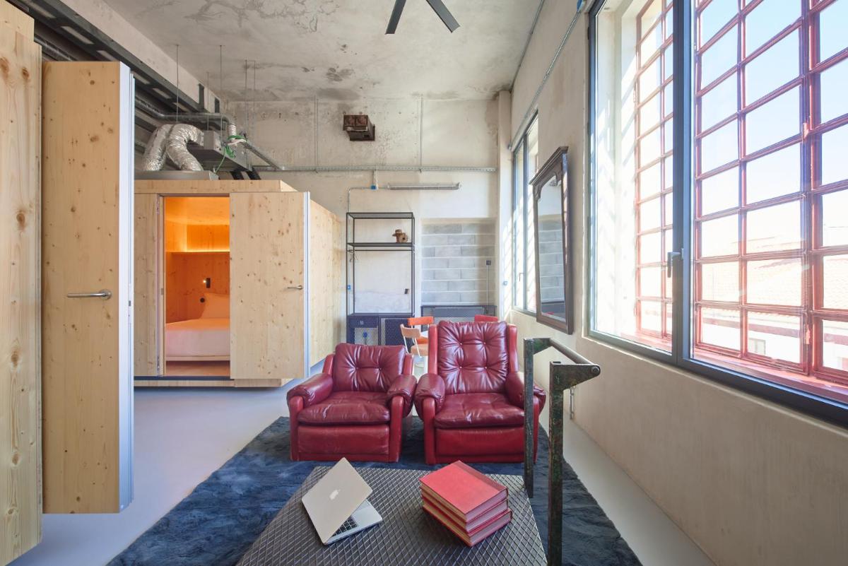 Uma área de estar em Moagem Industrial Lodge