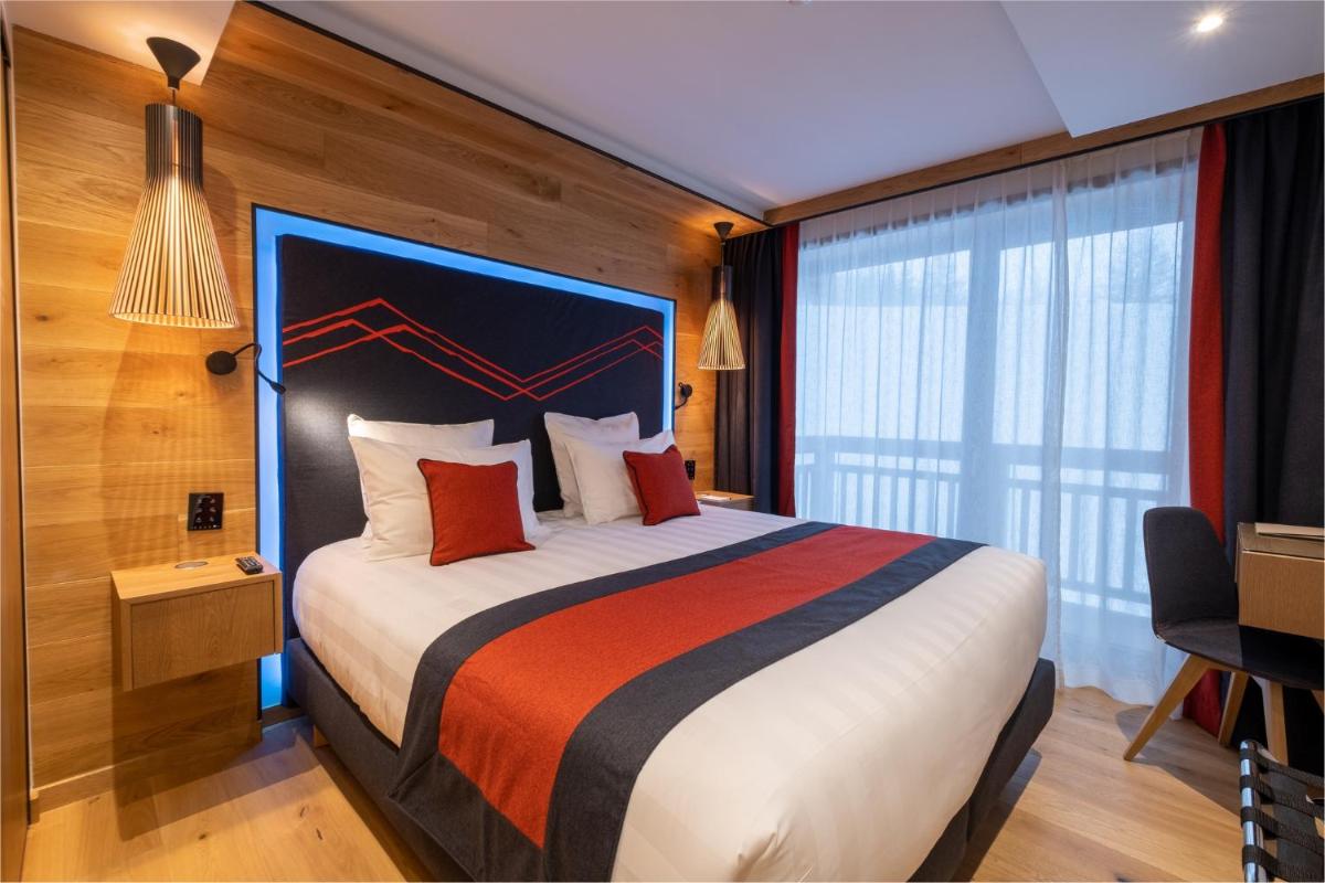 Un ou plusieurs lits dans un hébergement de l'établissement Hôtel Alparena & Spa - 4 étoiles