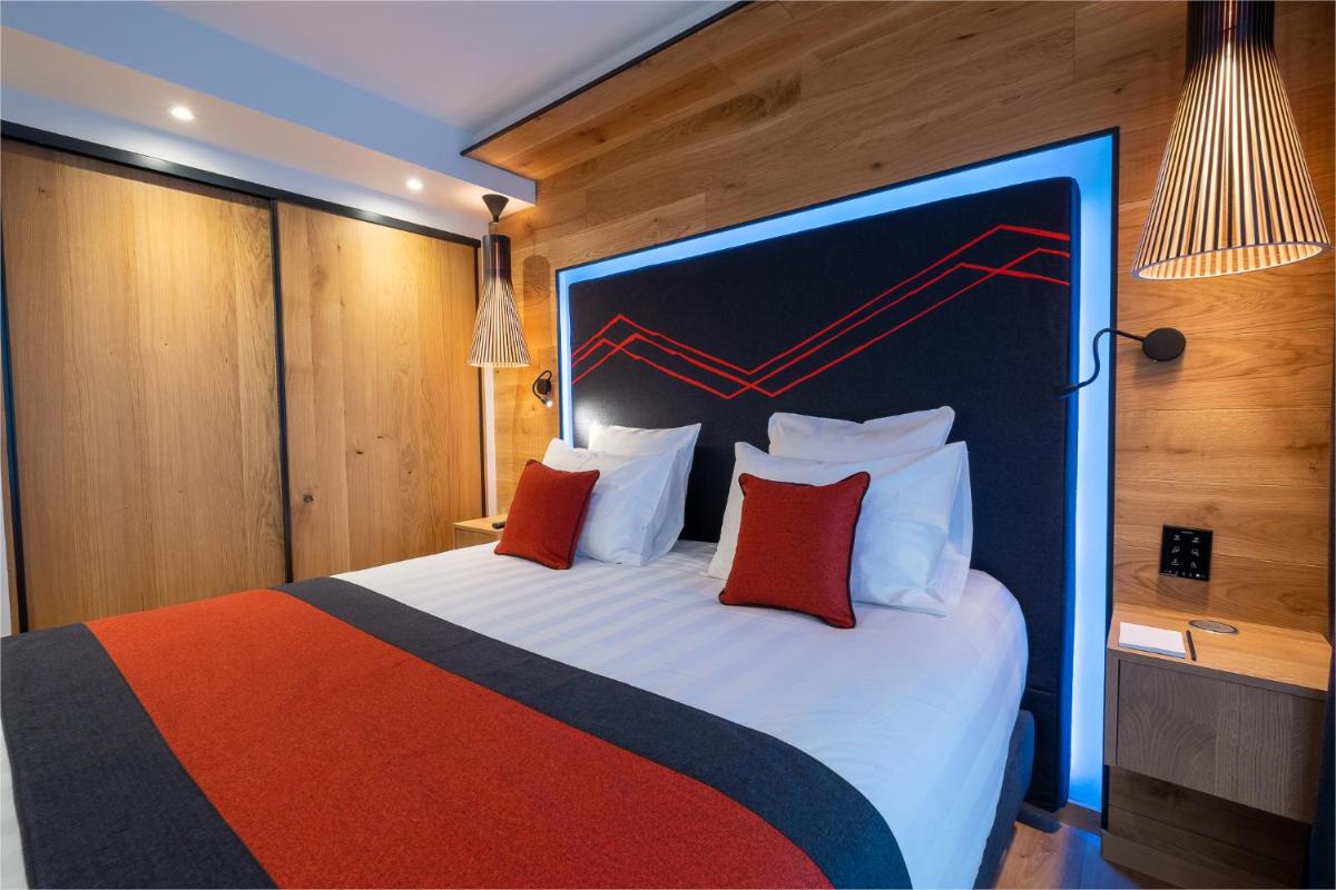 Un ou plusieurs lits dans un hébergement de l'établissement Hôtel Alparena & Spa - 4 étoiles