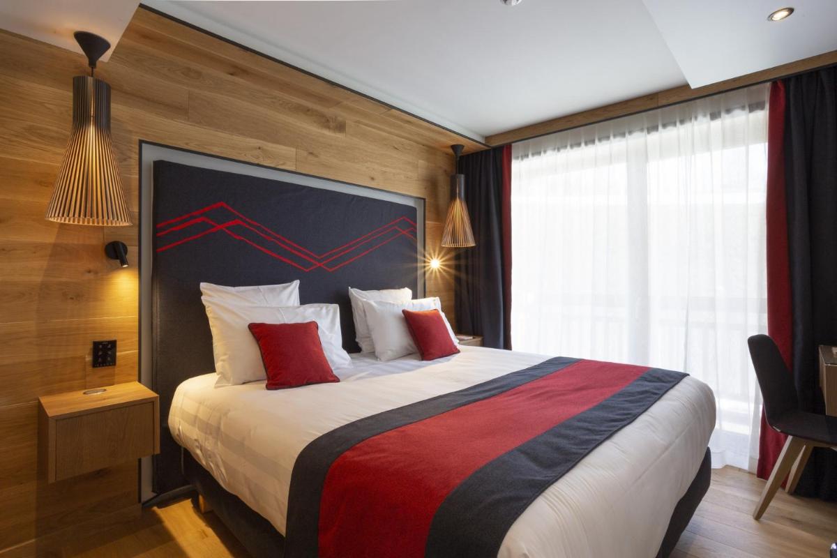 Un ou plusieurs lits dans un hébergement de l'établissement Hôtel Alparena & Spa - 4 étoiles