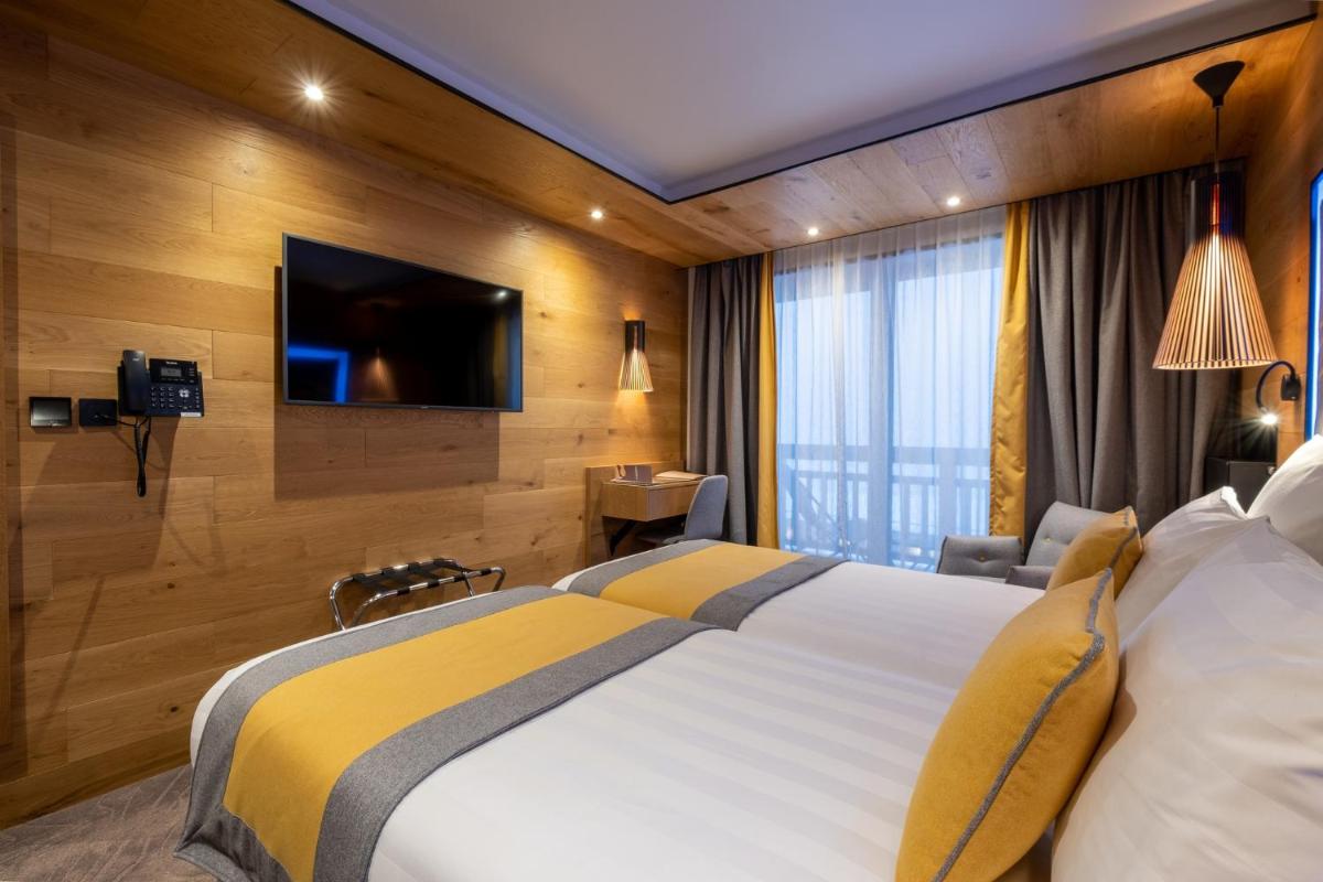 Télévision ou salle de divertissement dans l'établissement Hôtel Alparena & Spa - 4 étoiles
