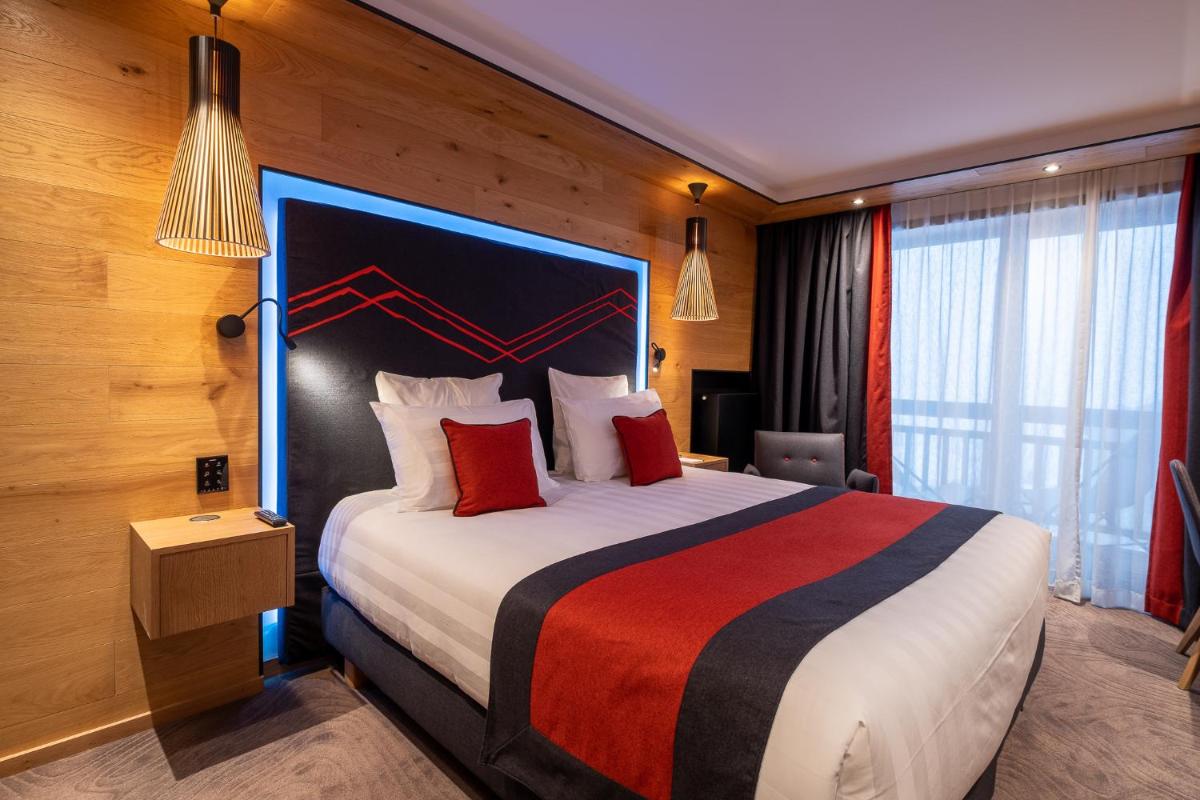 Un ou plusieurs lits dans un hébergement de l'établissement Hôtel Alparena & Spa - 4 étoiles