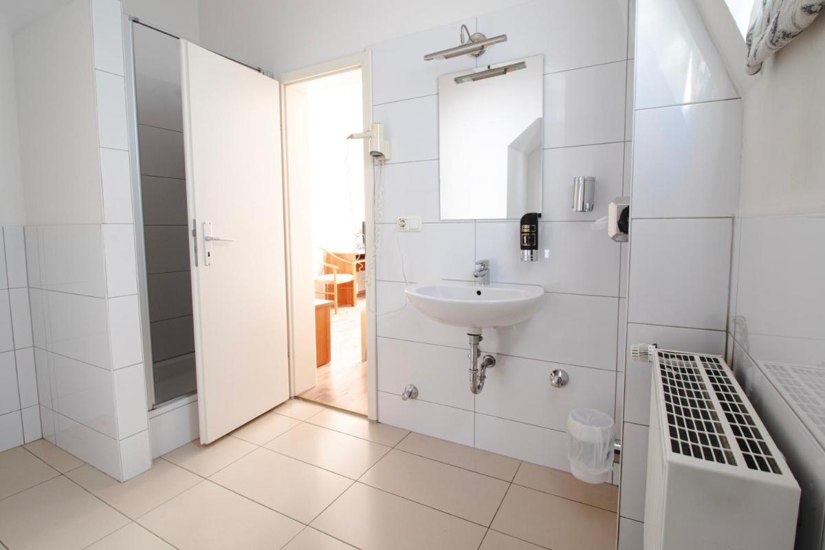 Ein Badezimmer in der Unterkunft Villa ENTO HotelWestEnd