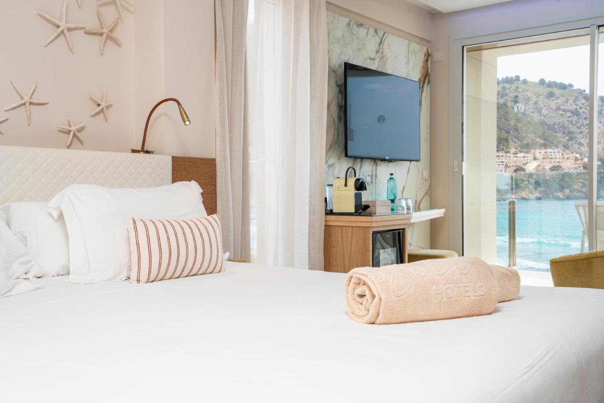 Cama o camas de una habitación en Melbeach Hotel & Spa - Adults Only