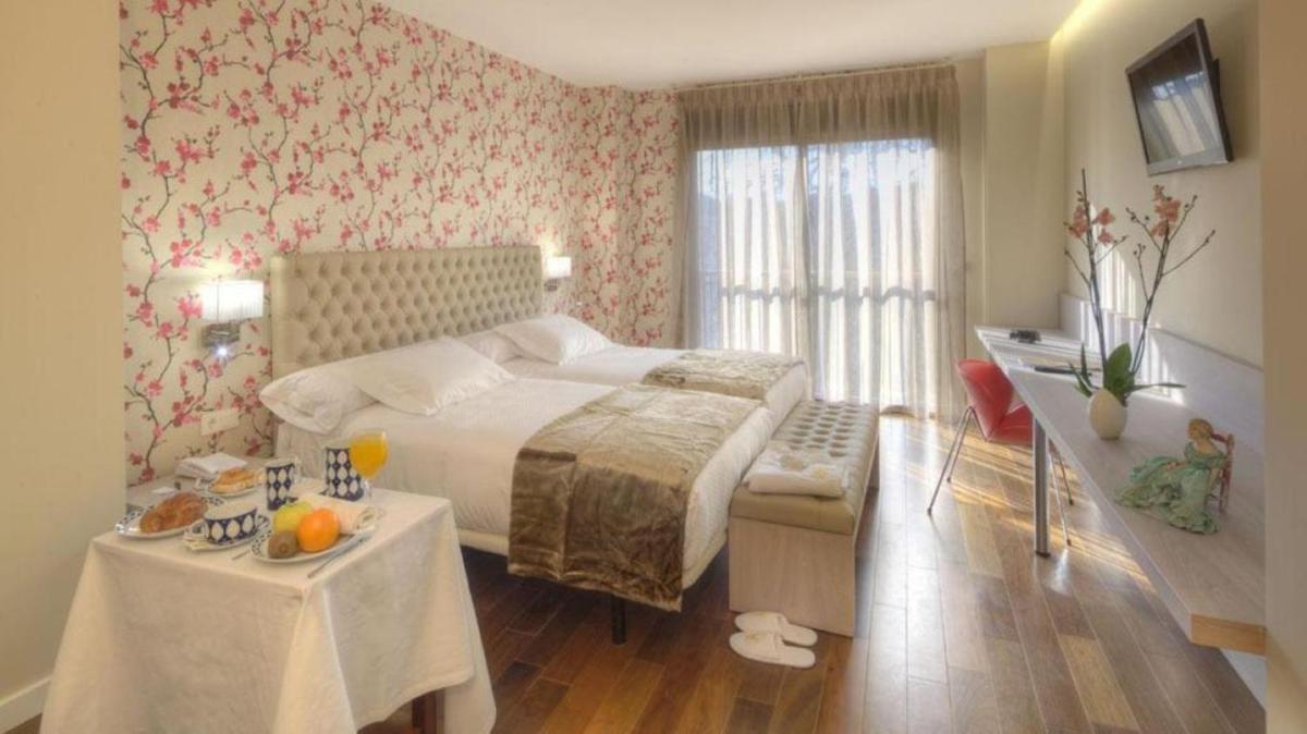 Cama o camas de una habitación en U-Hotel Spa Ciudad de Astorga