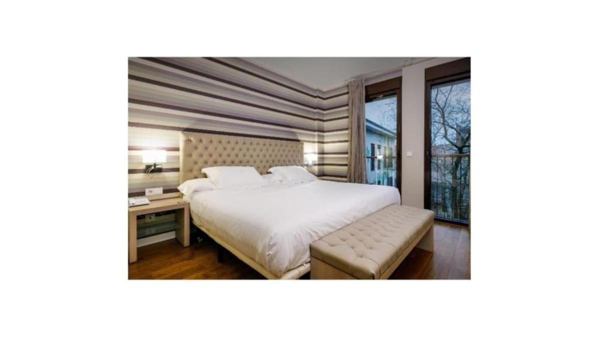 Cama o camas de una habitación en U-Hotel Spa Ciudad de Astorga