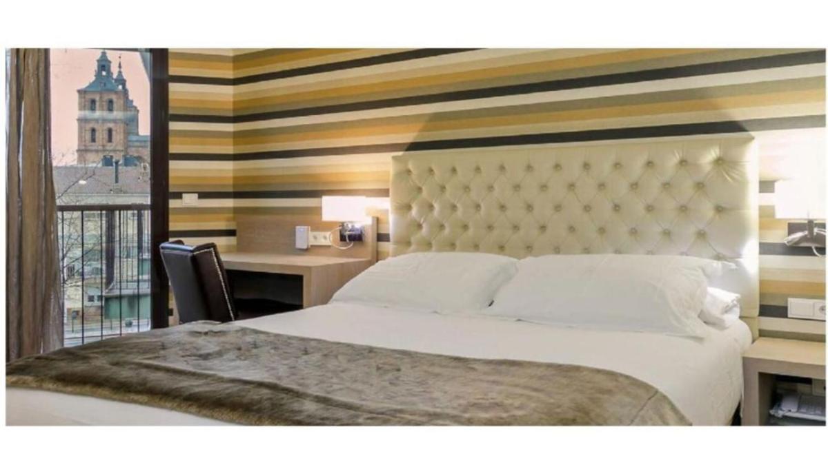 Cama o camas de una habitación en U-Hotel Spa Ciudad de Astorga