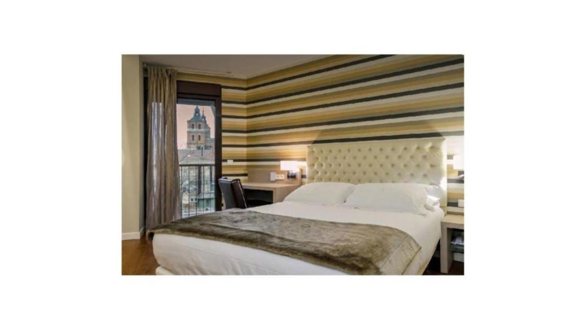 Cama o camas de una habitación en U-Hotel Spa Ciudad de Astorga