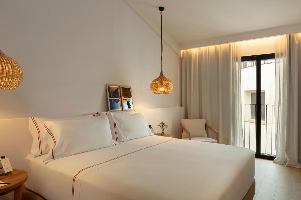 Cama o camas de una habitación en Elisabeth by the Sea Hotel