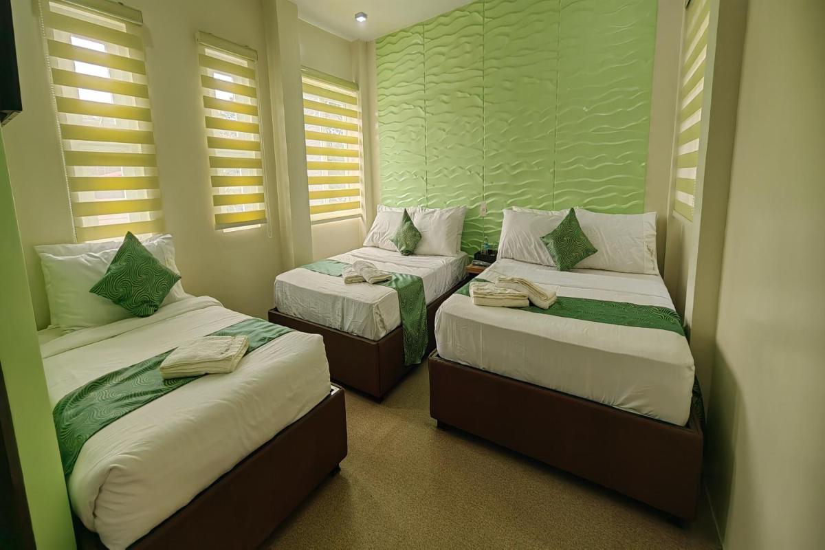 OYO 1063 Manuela's Suites - Housity