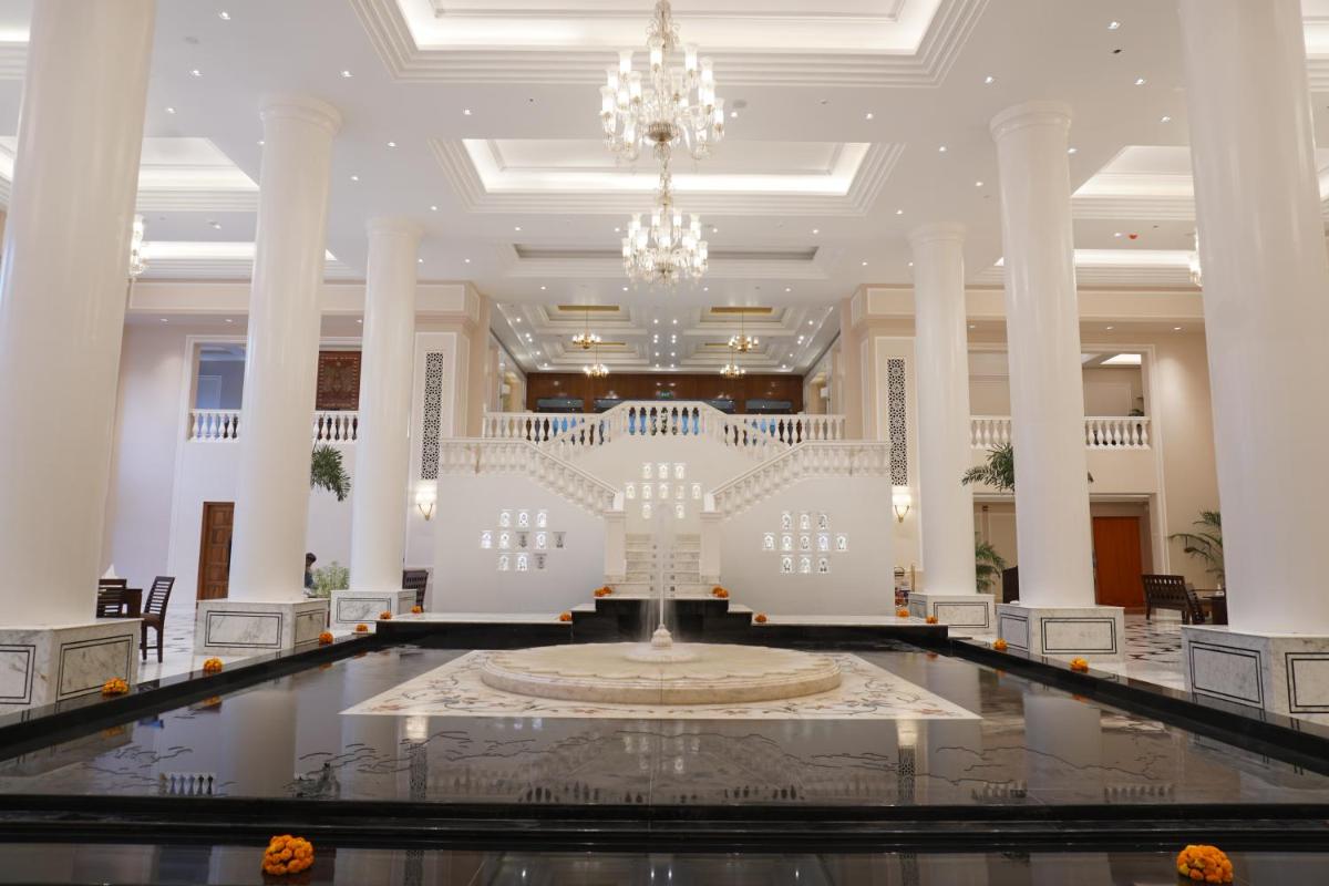 a large lobby with a fountain in the middle at Clarks Avadh in Lucknow +61 photos