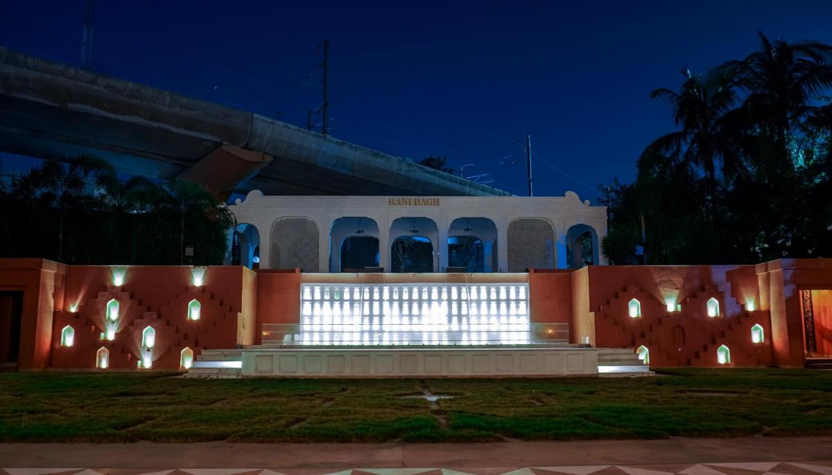 a building with lights in front of it at night at Clarks Avadh in Lucknow