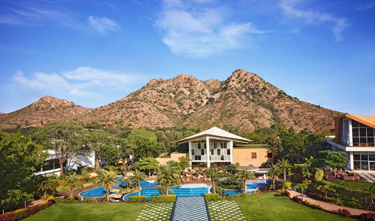 a view of a resort with a mountain in the background at Taj Aravali Resort & Spa Udaipur in Udaipur