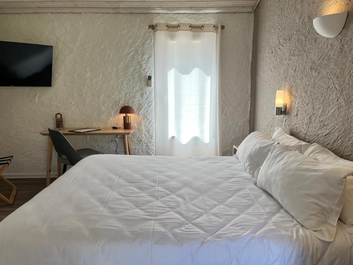Un ou plusieurs lits dans un hébergement de l'établissement Auberge Val Moureze Hôtel & Spa