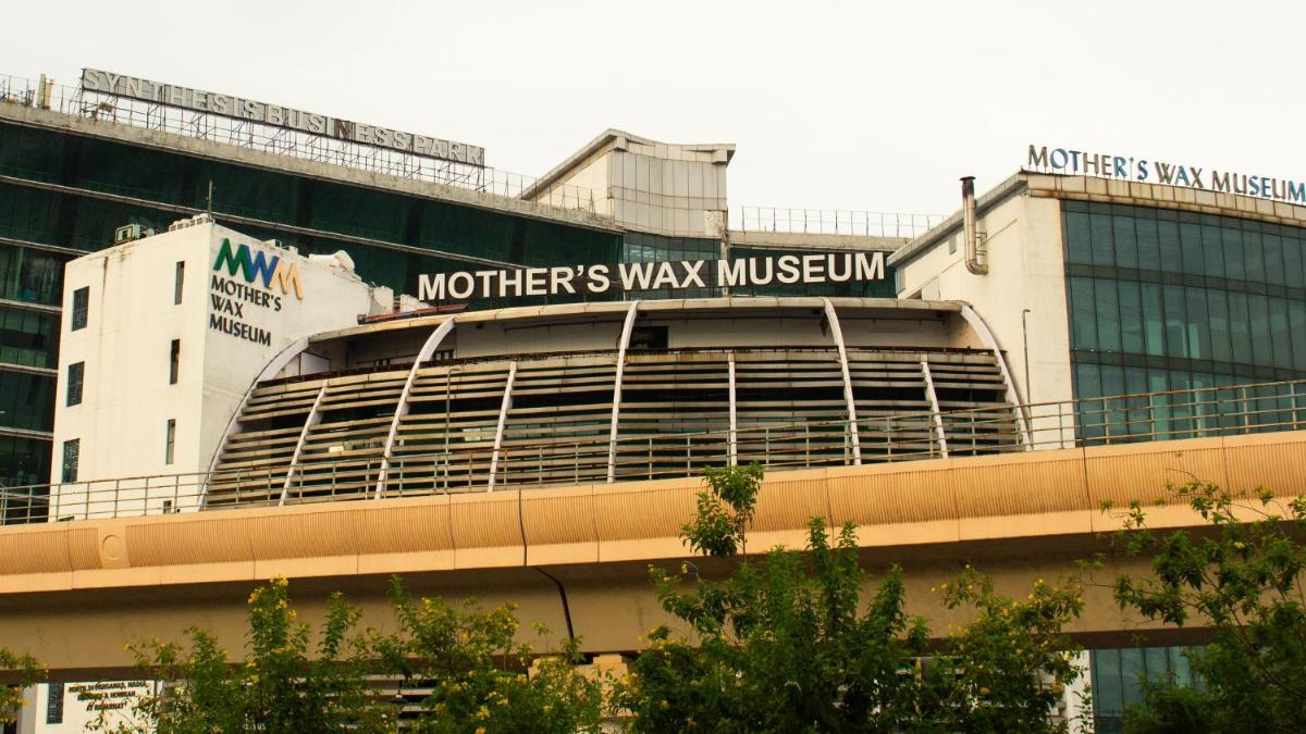a building with a sign that reads mothers way museum at Holiday Inn Kolkata Airport by IHG in Kolkata