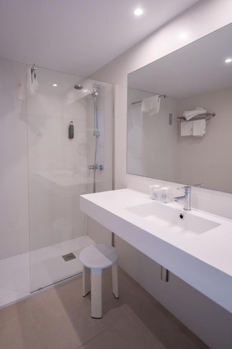 Un baño de Flamboyan Caribe Hotel & Spa
