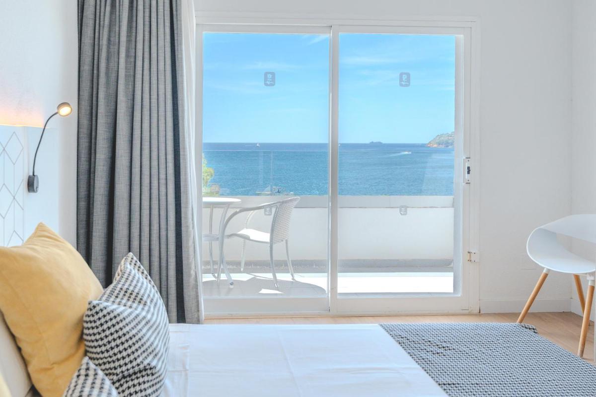 Cama o camas de una habitación en Flamboyan Caribe Hotel & Spa