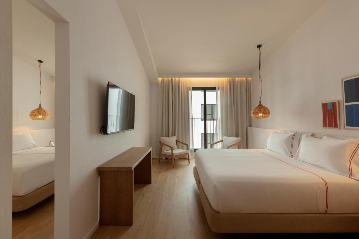 Cama o camas de una habitación en Elisabeth by the Sea Hotel