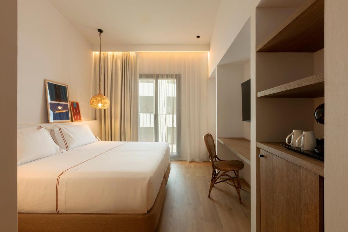 Cama o camas de una habitación en Elisabeth by the Sea Hotel