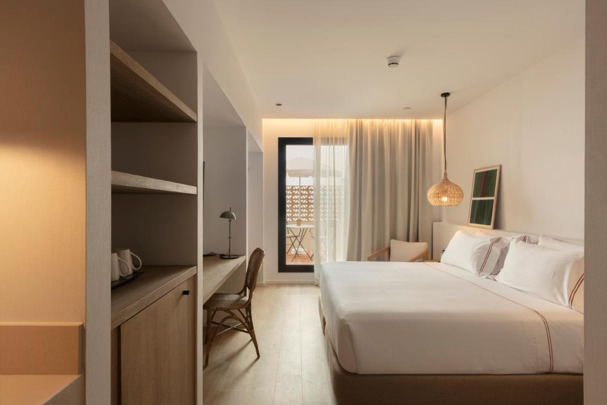 Cama o camas de una habitación en Elisabeth by the Sea Hotel