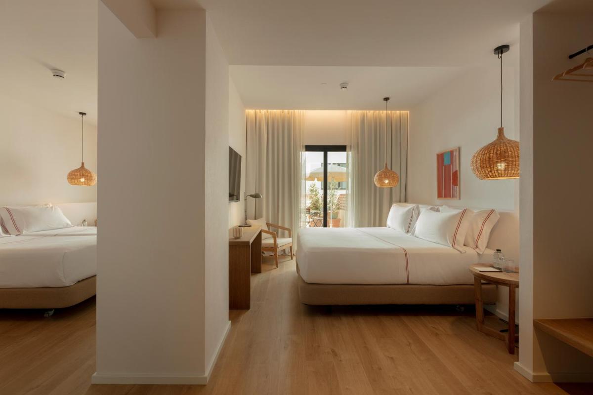 Cama o camas de una habitación en Elisabeth by the Sea Hotel