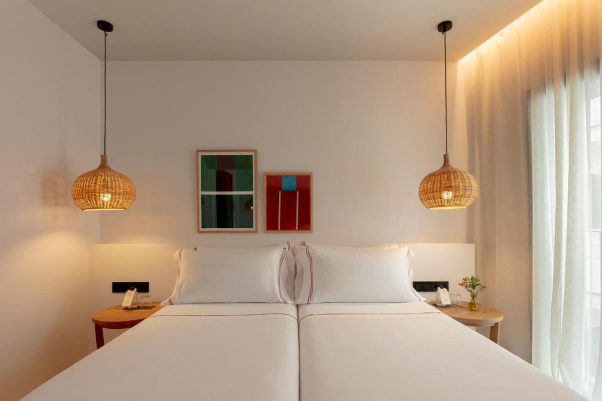 Cama o camas de una habitación en Elisabeth by the Sea Hotel