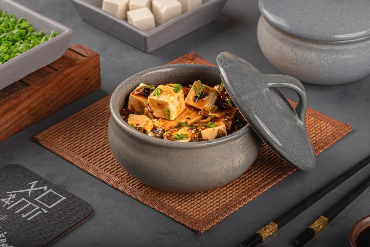 a bowl of food sitting on top of a table at Le Meridien New Delhi in New Delhi a bowl of food sitting on top of a table at Le Meridien New Delhi in New Delhi