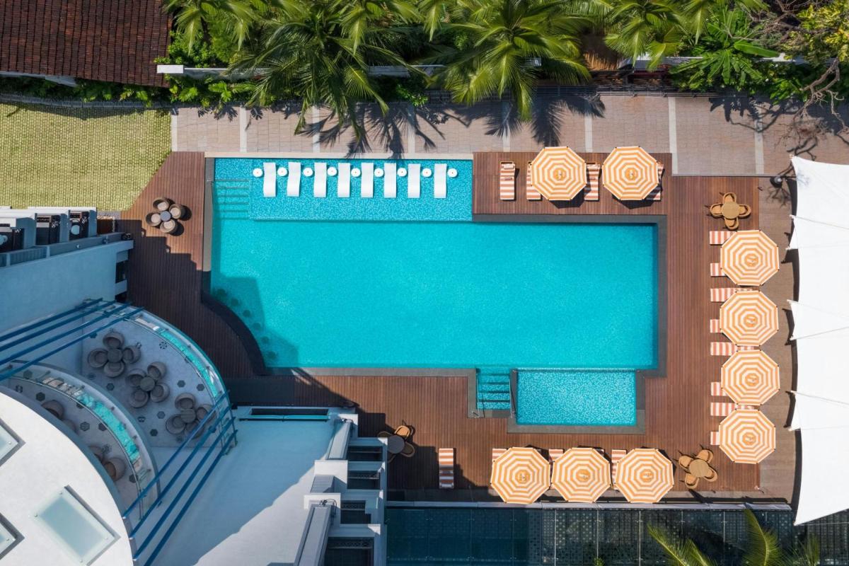 an overhead view of a swimming pool and a resort at Le Meridien Goa, Calangute in Calangute an overhead view of a swimming pool and a resort at Le Meridien Goa, Calangute in Calangute