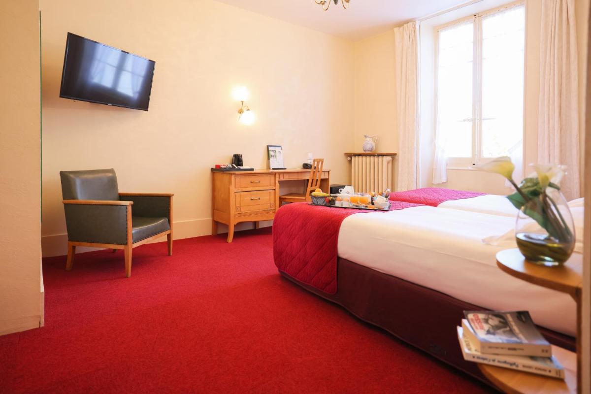 Un ou plusieurs lits dans un hébergement de l'établissement Best Western Grand Hotel de Paris & Spa