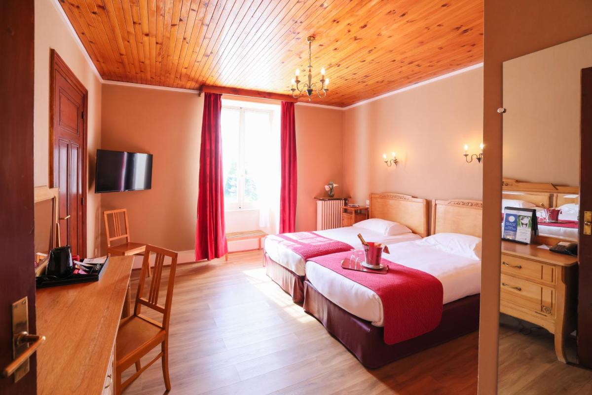 Un ou plusieurs lits dans un hébergement de l'établissement Best Western Grand Hotel de Paris & Spa